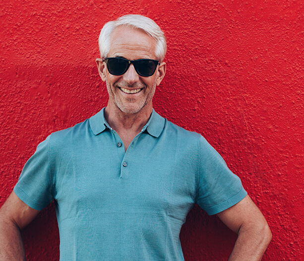 man wearing sunglasses and smiling
