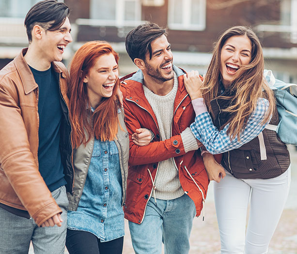 a group of young adults all smiling