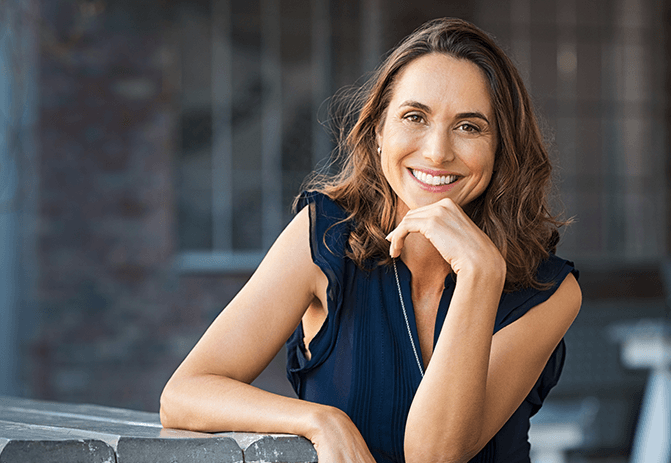 woman smiling at a table