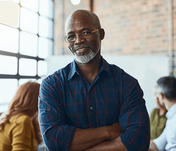 a man smiling at the camera