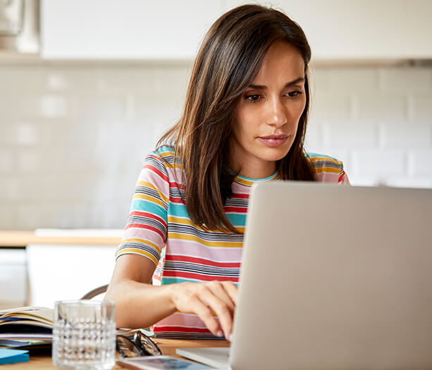 woman looking at her laptop