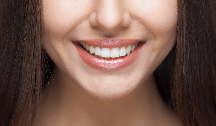 Closeup of a woman's mouth with beautiful teeth and healthy gums