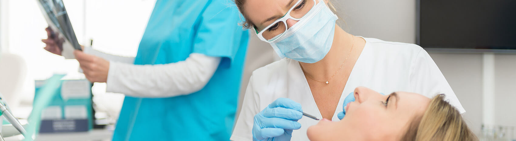 dentist examining a patient's mouth