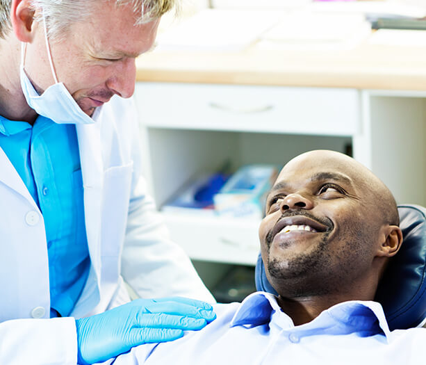 dentist comforting a patient